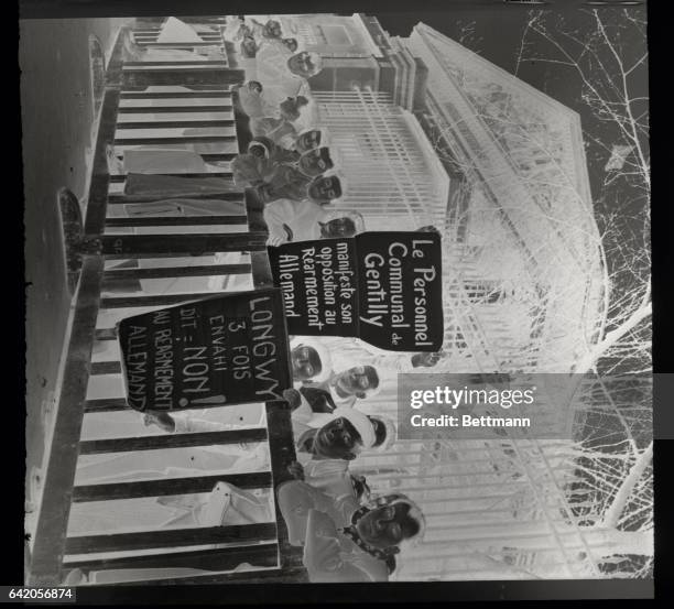 This crowd that gathered outside the French National Assembly during the dramatic session at which Premier Pierre Mendes-France fought for Assembly...