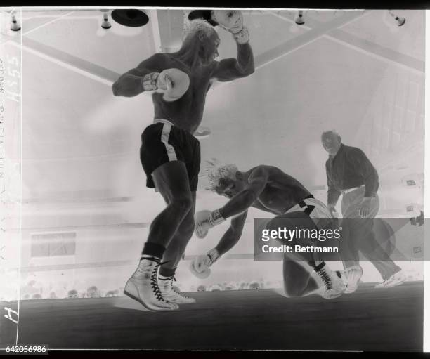 French middleweight Marcel Assire slips to the canvas in the ninth round of his bout with Gene Fullmer of Utah, at the Eastern parkway Arena. Ref Al...