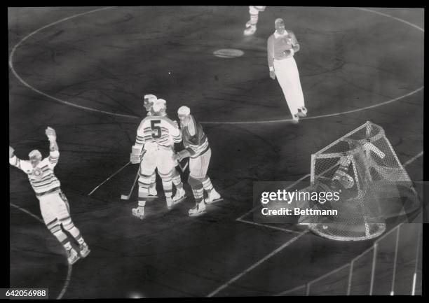 Red Sullivan, of the Chicago Black Hawks raises his hands triumphantly after making a successful drive in the third period of tonight's game with the...