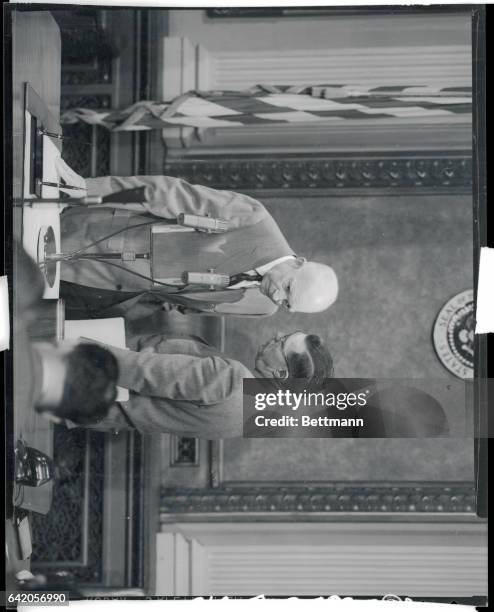 Hagerty confers with "the boss." Washington, D.C.: James Hagerty, White House press secretary is shown conferring with President Eisenhower at the...