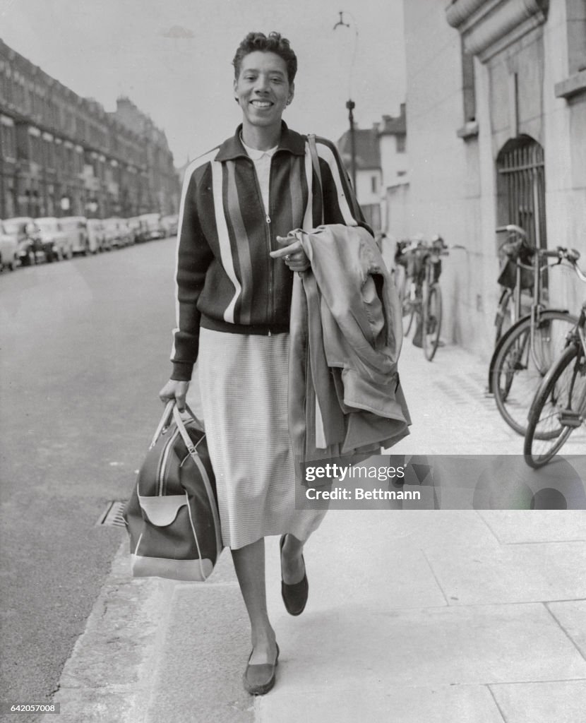 Althea Gibson Walking with Bag and Coat