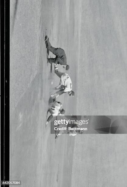 Lumpe of the Yankees is caught attempting to steal second in the second inning of the 6th World Series game at the Yankee Stadium today. Logan is...