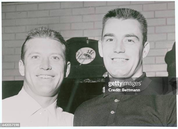 Minneapolis: New York Yankee slugging star Mickey Mantle and pitcher Bill Stafford pause briefly after the Yanks shut-out the Minnesota Twins August...