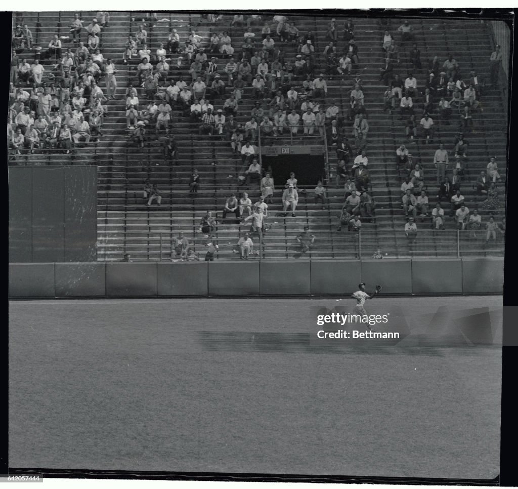 Hank Aaron Running to Catch Baseball