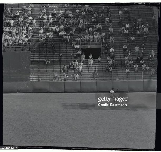 Aaron of the Milwaukee Braves does some fast and fancy stepping to pull in Spencer's long drive in the fourth inning of the game against the New York...