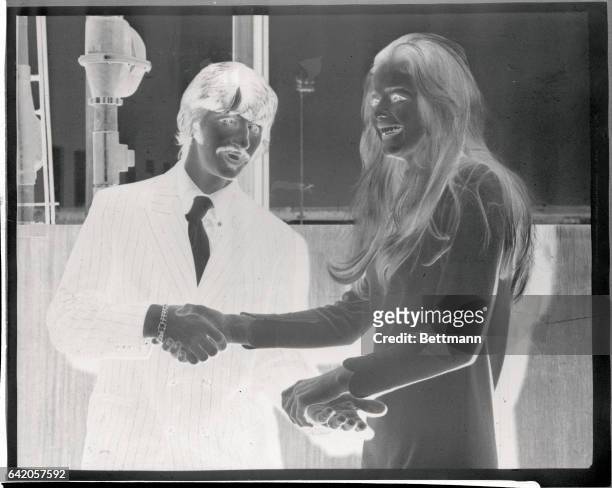 Rome: Clasping Hands. Swedish actress Ewe Aulin greets Beatle Ringo Starr at the airport here 12/3, and they exchange an unusual double handshake....