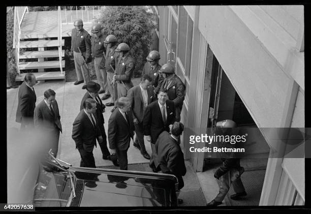 Berkeley, California: Gov. Ronald Reagan walks past some of the 100 law enforcement officers assembled at University Hall on his arrival to attend...