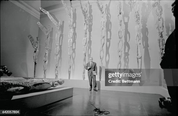 New York, NY- New York's Governor Neslson Rockefeller stands in an exhibit hall at New York's Metropolitan Museum of Art May 8th in front of some of...