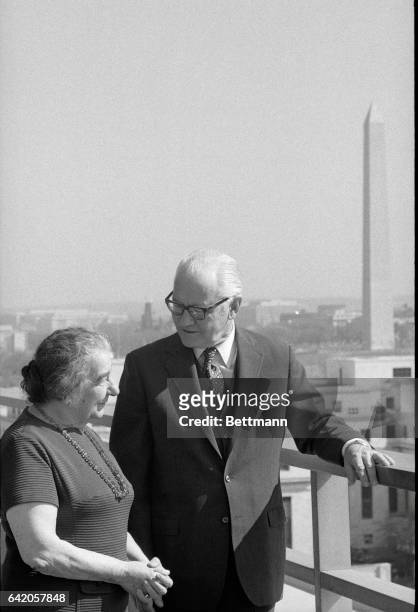 Washington, D.C.: Israeli prime minister Golda Meir chats with acting Secretary of State Kenneth Rush on the balcony of the State Department just...