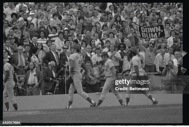 Pete Rose of the Cincinnati Reds seems to have pinned Bud Harrelson to the ground getting the upper hand as he battles the New York Mets' shortstop...