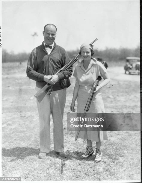 Keeping the congratulations in the family...Mrs. C.T. Jackson of New York, congratulates her husband on winning the North and South Handicap...