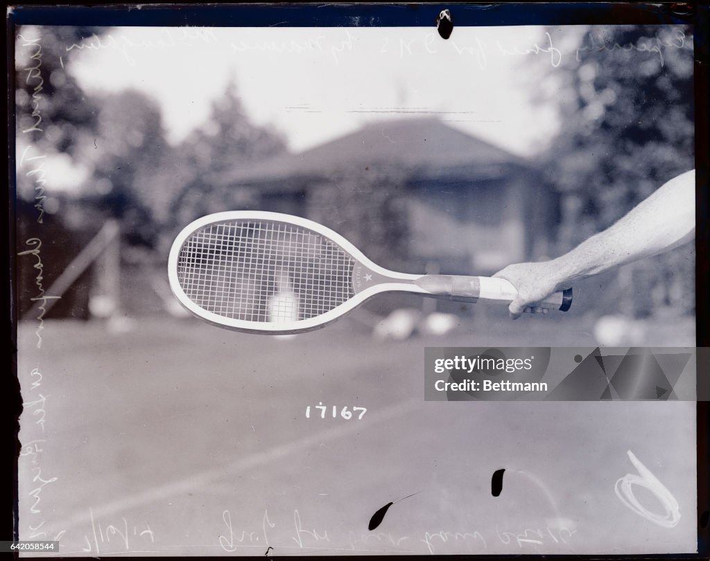 Hand Gripping Tennis Racket