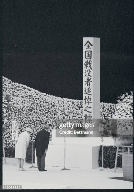 Pay Tribute. Tokyo, Japan: Emperor Hirohito and Empress Nagako pay silent tribute to the 3 000 war dead at memorial service in Nippon Budokan Hall...