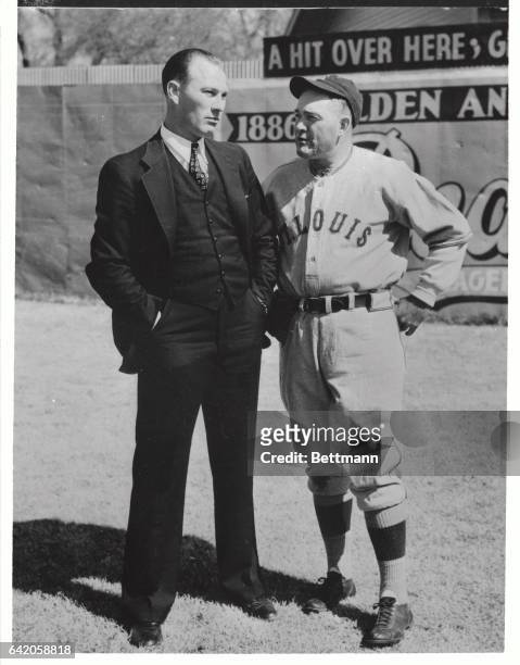 Manager Rogers Hornsby of the St. Louis Browns, is shown at right with Beau Bell, 1936's best Rookie of The Year, who hit .344 and who was holding...
