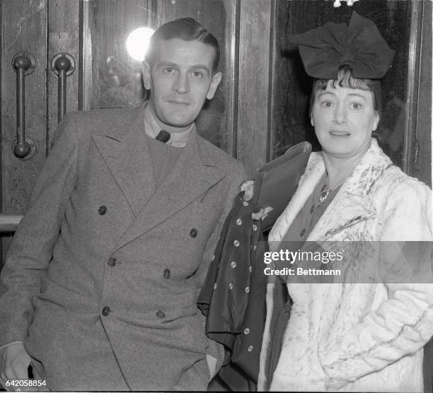 Dorothy Parker, noted writer and humorist, and her actor husband, Alan Campbell, are shown as they arrived in New York City frim Europe on the S.S....