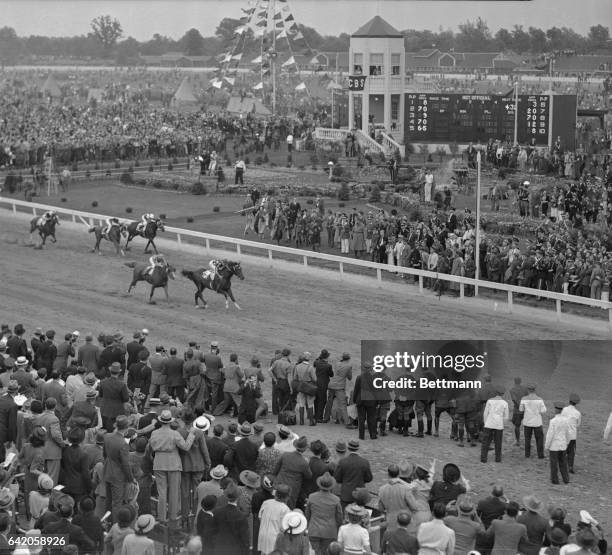 Lawrin, Herbert M.Woolf's Ozark bred three-year-old, with Jockey Eddie Arcaro up, pounding across the finish to capture the 64th running of the...