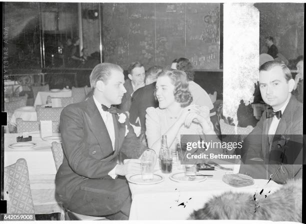 New York City: Socialites On Night Club Outing. Billy Livingston and Willa Blake, socialites, pictured April 6 at the Kit Kat Club here. Miss Blake...