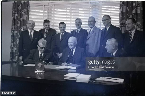 Gettysburg, PA- Ex-President Eisenhower enjoys a laugh with some GOP leaders during a meeting. Seated, are: Sen. Everett Dirksen of IL; Eisenhower;...