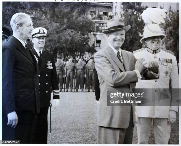 Hamilton, Bermuda: President Eisenhower strikes a happy pose during the official ceremony welcoming him to Bermuda for his conference with British...