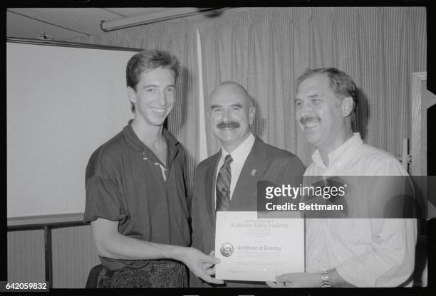 Nanuet, N. Y.: Ron Reagan Jr., , and author David Morrell, , the man who created Rambo in his book, First Blood, receive their certificates from G....