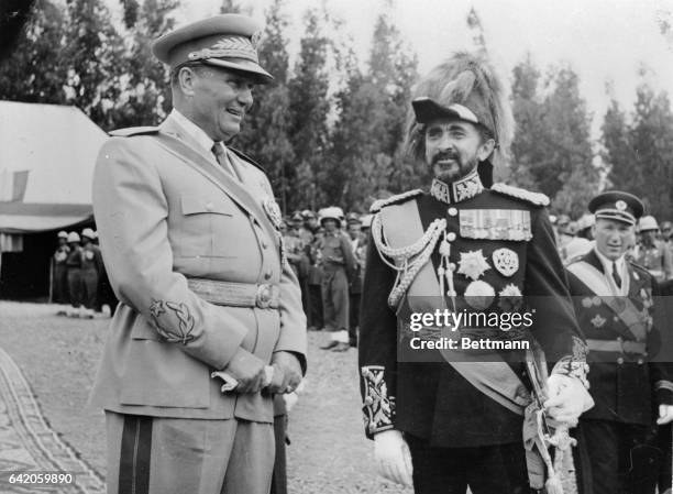 Emperor Haile Selassie of Ethiopia greets Yugoslavia's Marshal Tito on the outskirts of the Ethiopian capital, Addis Ababa, on the latter's recent...