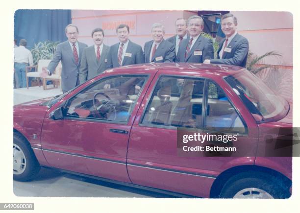 Governors stand in front of the new General Motors Saturn February 26 on the set of the Phil Donahue Show. They have made bids to GM to get the...