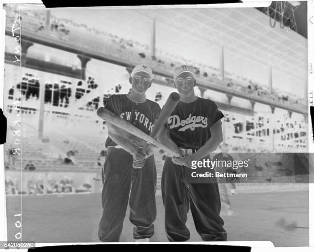Rival shortstops Alvin Dark of the Giants and Pee Wee Reese of the Dodgers face the camera before start of double-header. Dark won shortstop position...