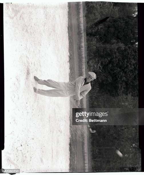 Bantam Ben Hogan tries shots from the sand as he preps for the 19th Masters Tournament at Augusta National Golf Course. Going into the final round,...