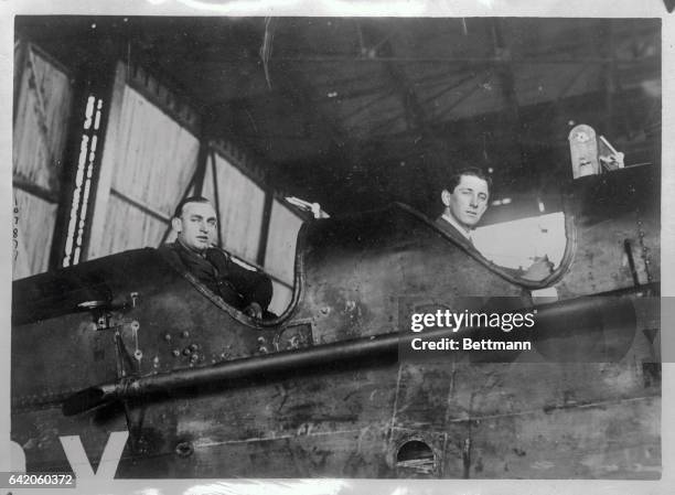 Townsend and pilot Navigator S. Sydney Cotton photographed in Paris on their arrival from London on the first leg of their proposed 9,000 mile...