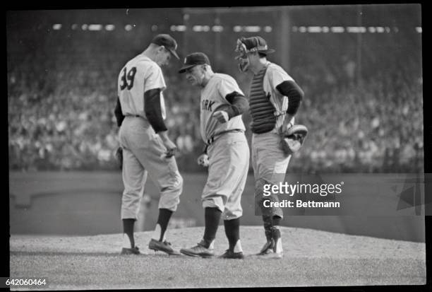Seventh game of Word Series between Pirates and Yankees. Casey Stengel, Yankees Manager talks to relief pitcher JIm Coates in the eighth inning as...