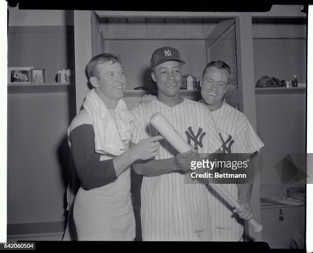 This Yankee trio today played a major role in taming the Detroit Tigers who were leading in the ninth inning. From left in the dressing room after...