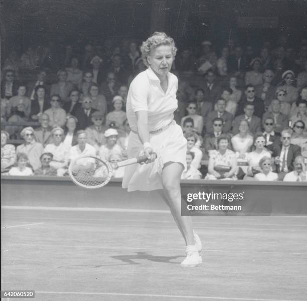 Louise Brough in Action. Wimbledon, England: Photo shows Miss Louise Brough in action against Mrs. B. Penrose during their singles match at Wimbledon...