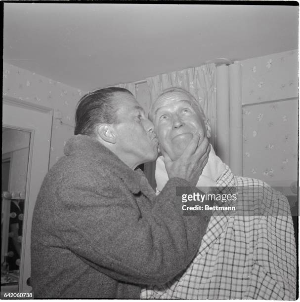 New York, New York- TV personality Ed Sullivan gives his version of a Gallo kiss to French entertainer Maurice Chevalier. Chevalier had just finished...