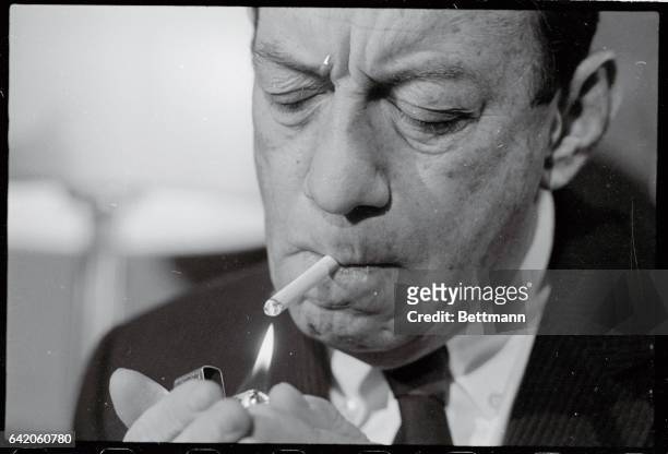 Mayor Robert Wagner, of New York City, lights up a cigarette during a press conference at which time he said there was no "deal" with anyone--as...