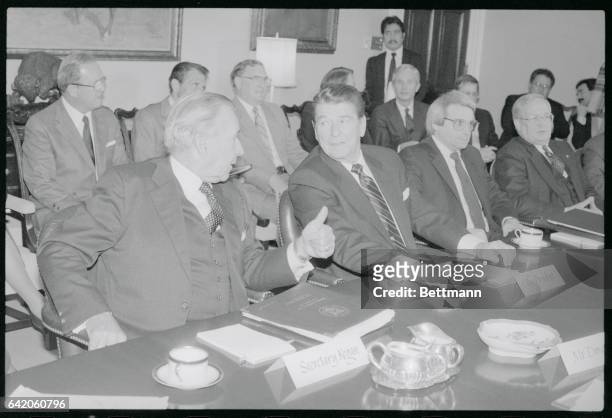 Washington, DC: President Reagan meets with business leaders concerning the deficit at the White House; Reagan is flanked by Treasury Secy. Donald...