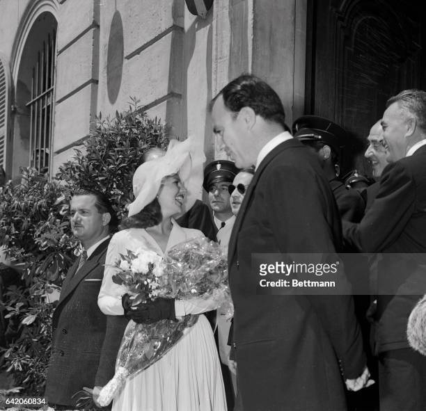 Actress Rita Hayworth and Prince Aly Khan leave Vallauris City Hall, May 27, following their marriage by the town's mayor. The couple then received...