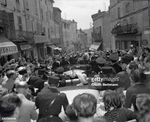 Actress Rita Hayworth and Prince Aly Kahn ride through the streets of Vallauris, May 27, following their wedding in the city Hall. A reception for...
