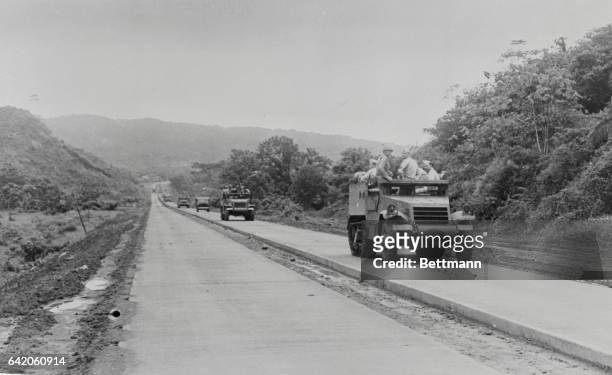 Panama Canal Cone: The Run Over New Defense Highway In Panama. A unit of U. S. Field artillery is shown manning the 48-mile run across the Isthmus of...
