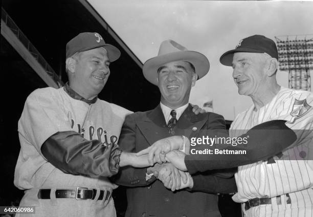 Happy Chandler, the "Almost Ex-"Commissioner of baseball, is in a festive mood as he wishes both managers good luck before the All-Star Game, July...