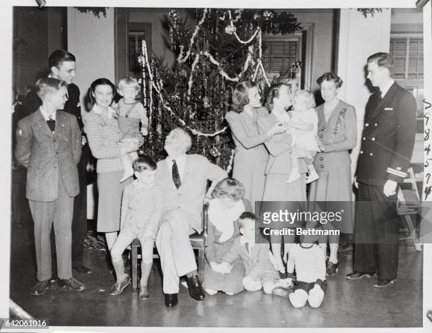 Left to right- Curtis Boettiger, 13; Lt.F.D.R., Jr.; Mrs. F.D.R., Jr. Holding her son Christopher; Franklin 3rd, on lap of Pres.; Pres.FDR; Anna...