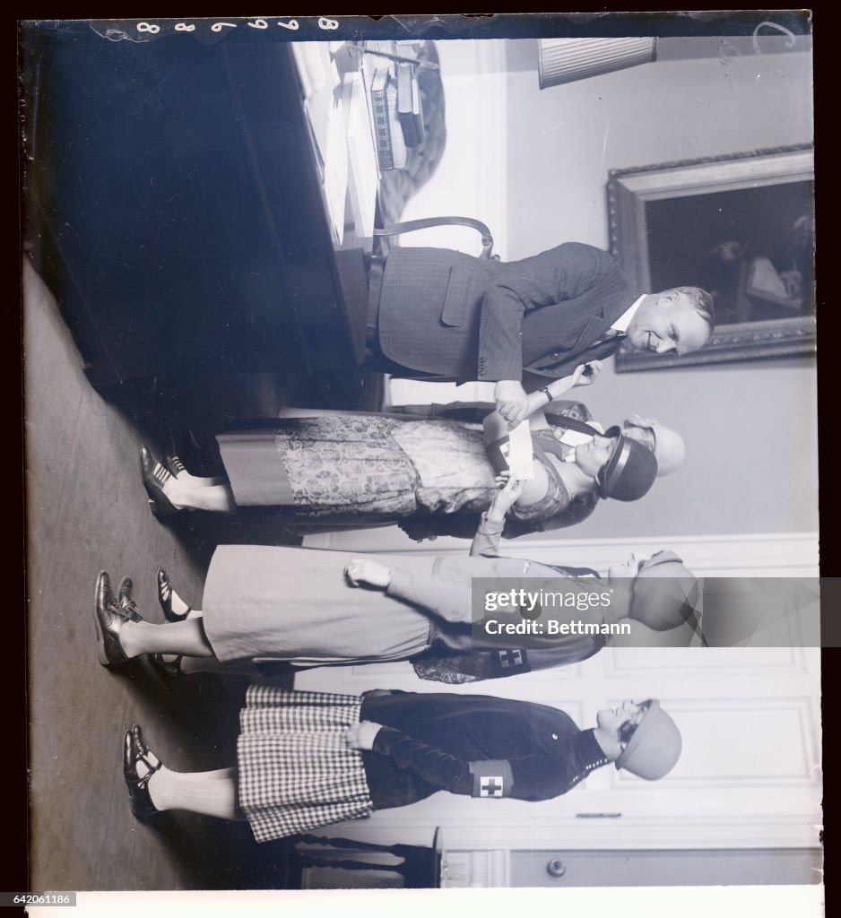 Massachusetts Governor Conversing With Red Cross Workers