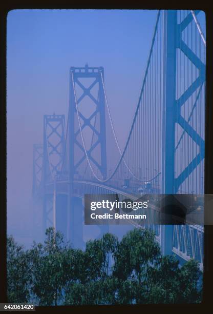 San Francisco-Oakland Bay Bridge looking toward portion of San Francisco obscured by smog.
