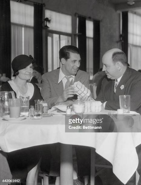 Russell Clark, president of the New Orleans Cotton Exchange, and his wife were interested visitors at the Paramount Studios where they watched the...