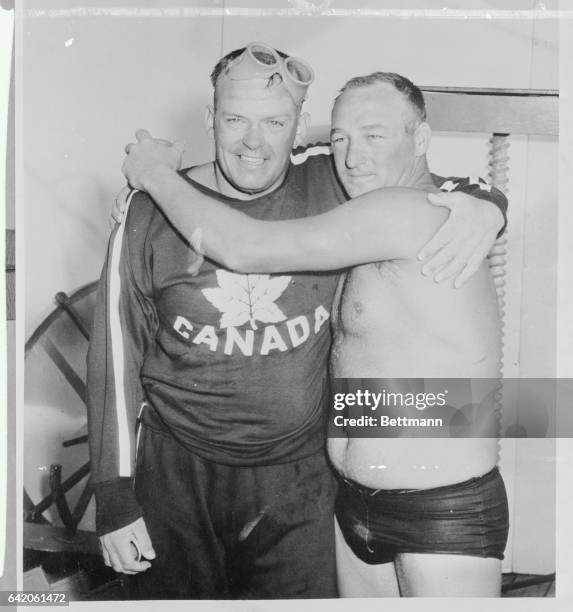 Tom Park, right, Canadian born swimmer from Lakewood, California, winner of the Atlantic City Centennial World's Championship long-distance swim...