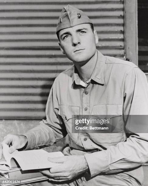 Marine Second Lieutenant Bob Mathias, two time Olympic decathlon champion, pauses between classes at Marine Corps School, Quantico, Virginia, where...