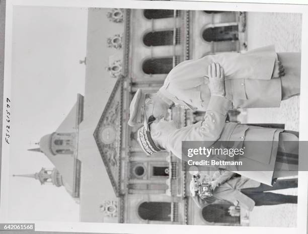 General Augustin Guillaume, French chief of staff, is shown embracing General Moshe Dayan, 39 year old Israeli chief of staff, after bestowing the...