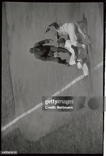 San Francisco Giant's center fielder Willie Mays is out at third on a perfect peg from Los Angeles Dodgers right fielder Ron Fairly in the 3rd inning...