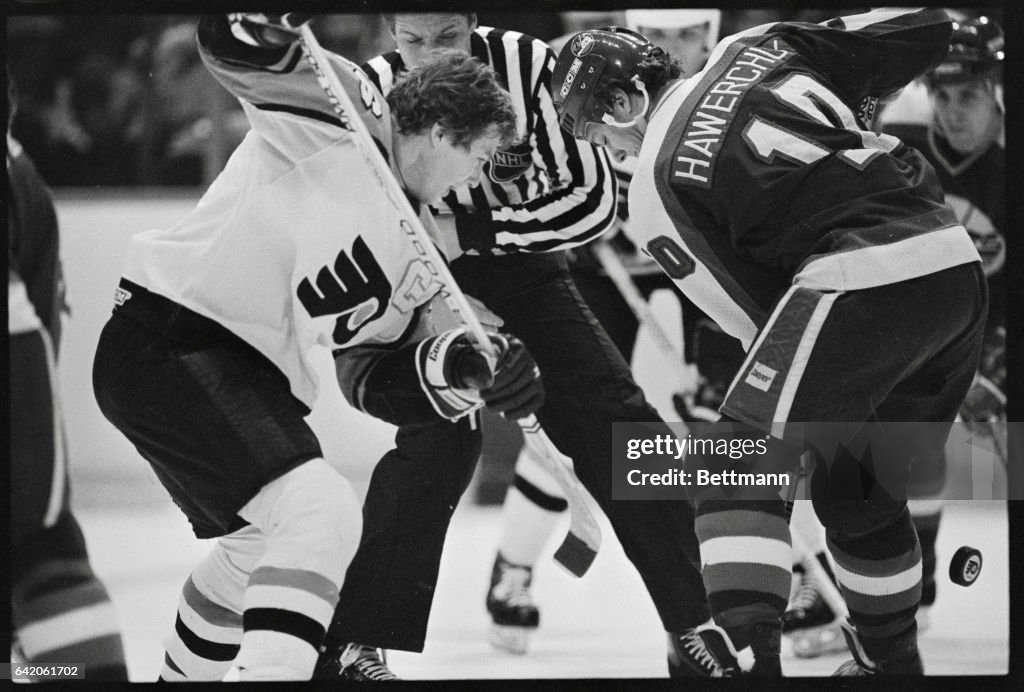 Dale Hawerchuk and Bobby Clarke Facing Off