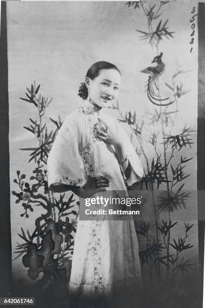 Miss E. E. Dick, the Chinese girl daredevil who so demure in countenance and expressive of self confidence is defiant of all Chinese ethics saying a...