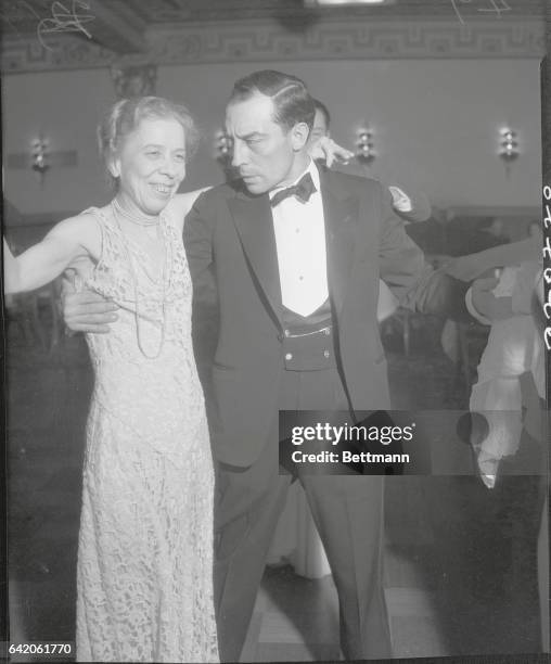 Agua, California: Keaton Dancing. Taking His Dancing Seriously. Buster Keaton, the popular screen comedian, dancing with Eileen Bramley, at the Agua...